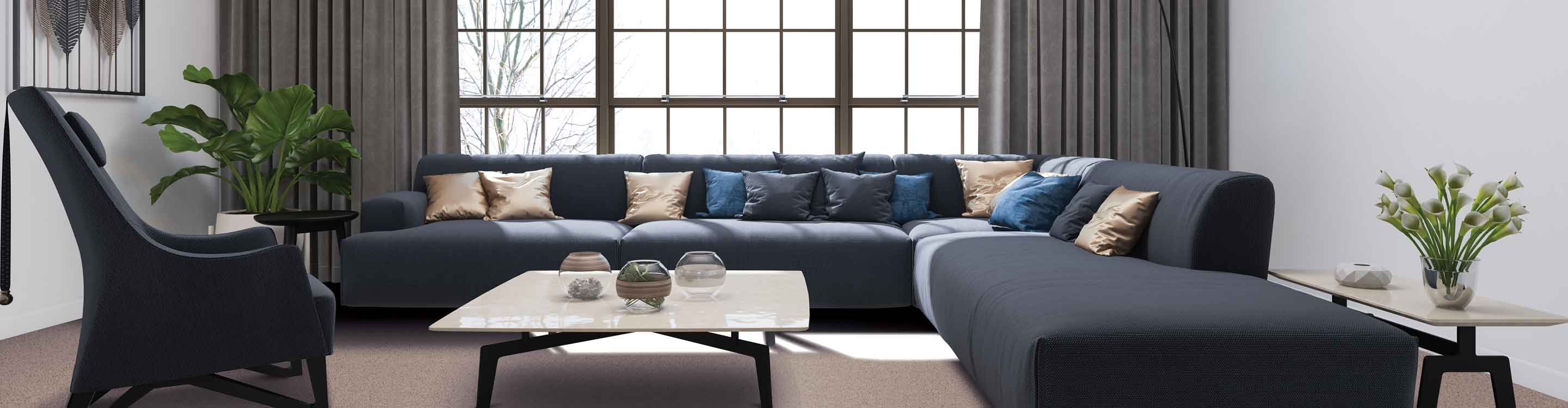 Modern living room featuring a large grid-style window framed by elegant floor-to-ceiling taupe drapes, with a navy sectional sofa and a marble-top coffee table in the foreground.